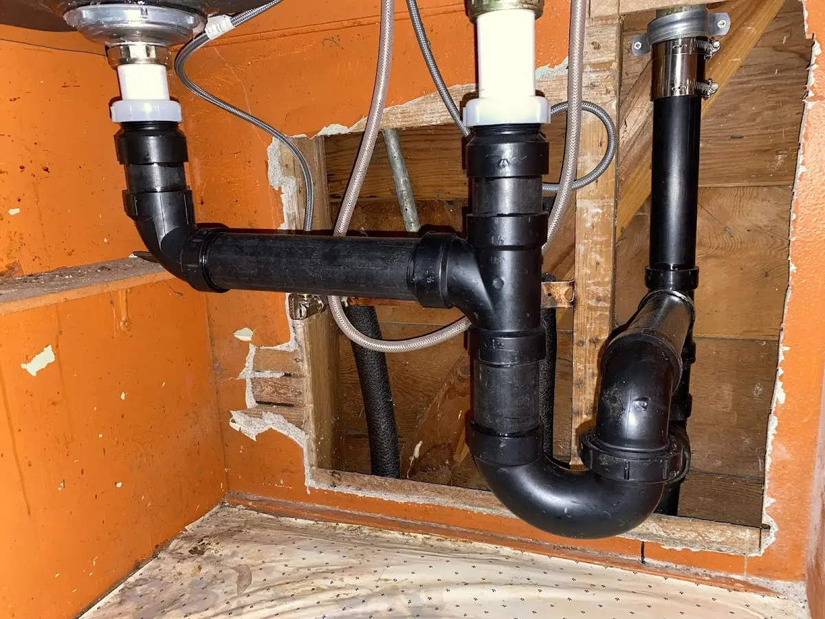 Professional Garbage Disposal Repair equipment and tools on the job in Amite City